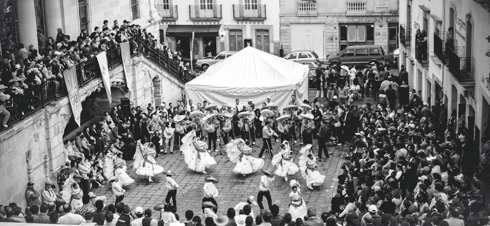 a large crowd of people in a street