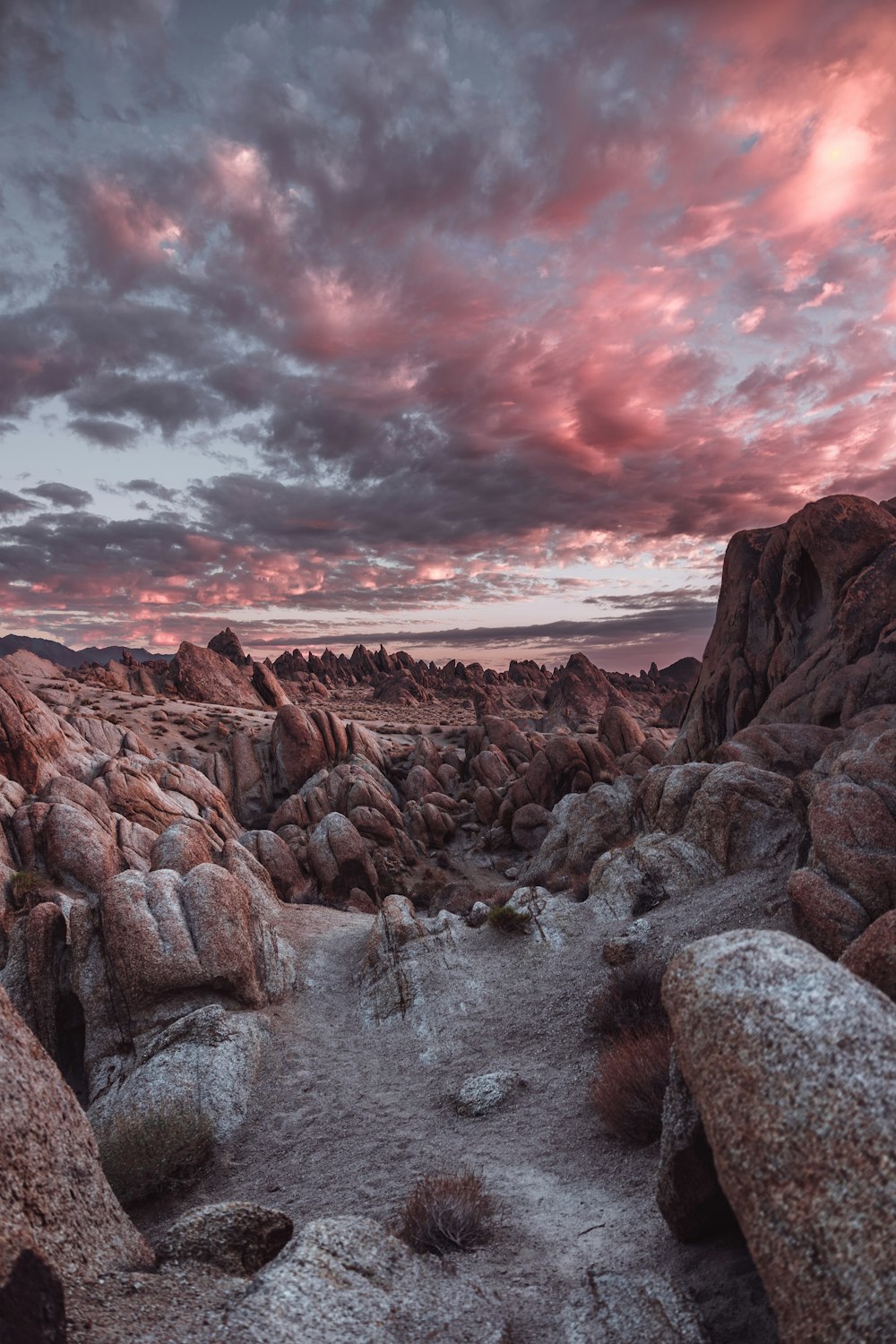 a rocky canyon with a sunset