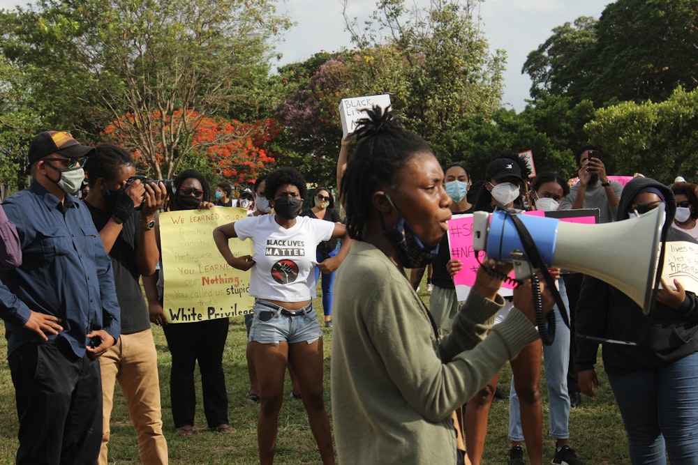 a group of people holding signs