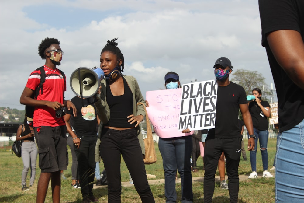 a group of people holding signs