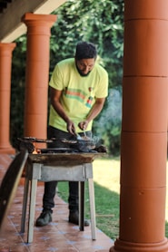 a man cooking outside
