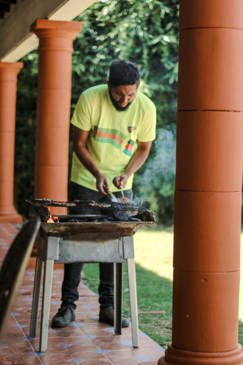 a man cooking outside