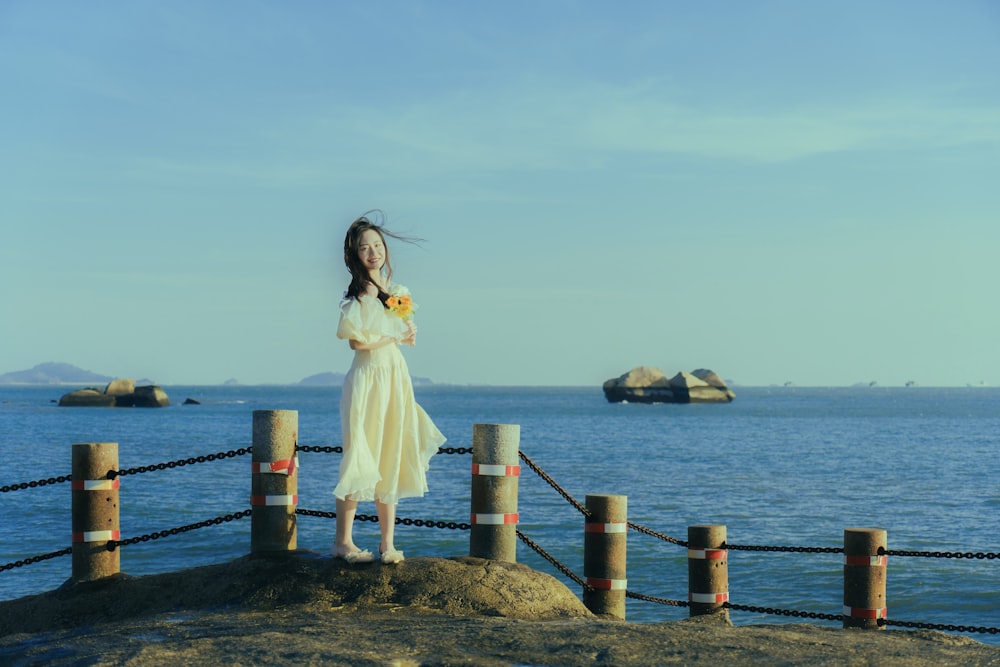 a person standing in front of a body of water