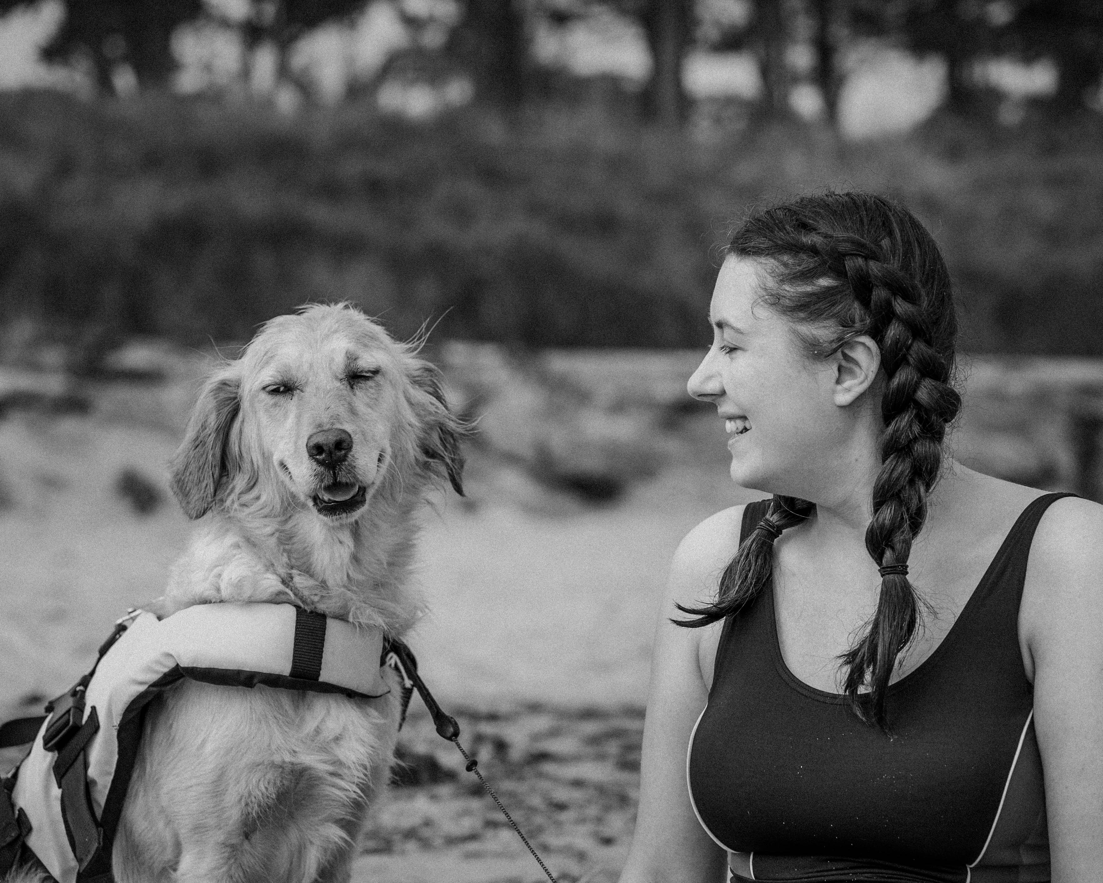 Sarah Johnson, Founder and CEO, smiling woman with golden retriever representing pet naming expertise