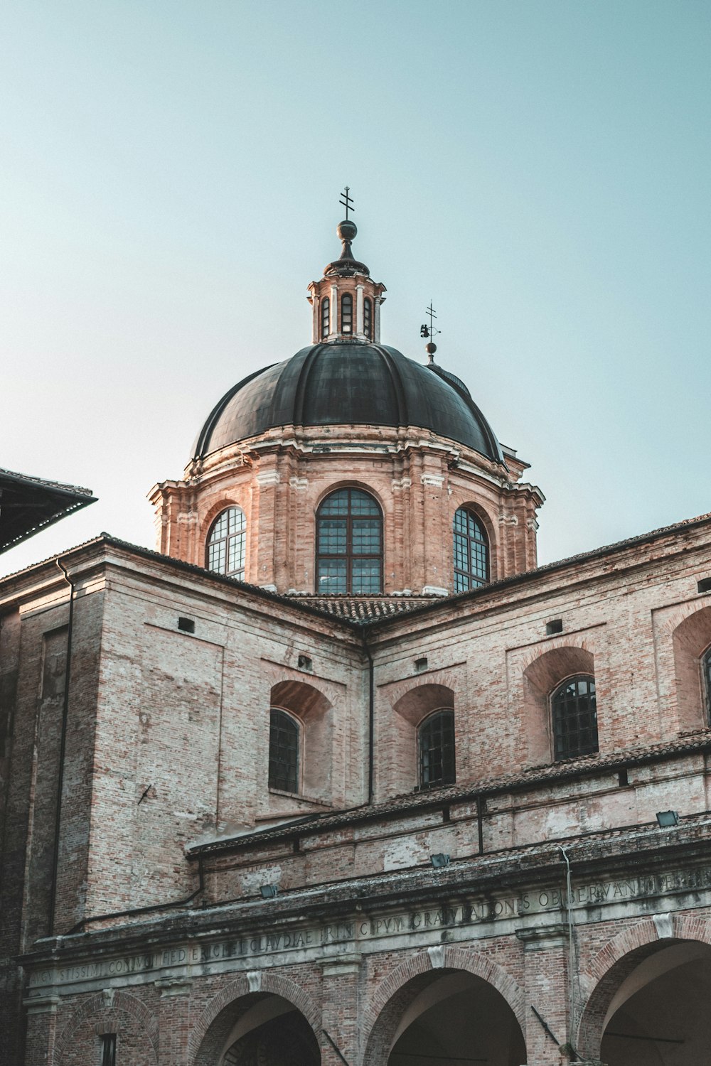 a large brick building with a domed roof