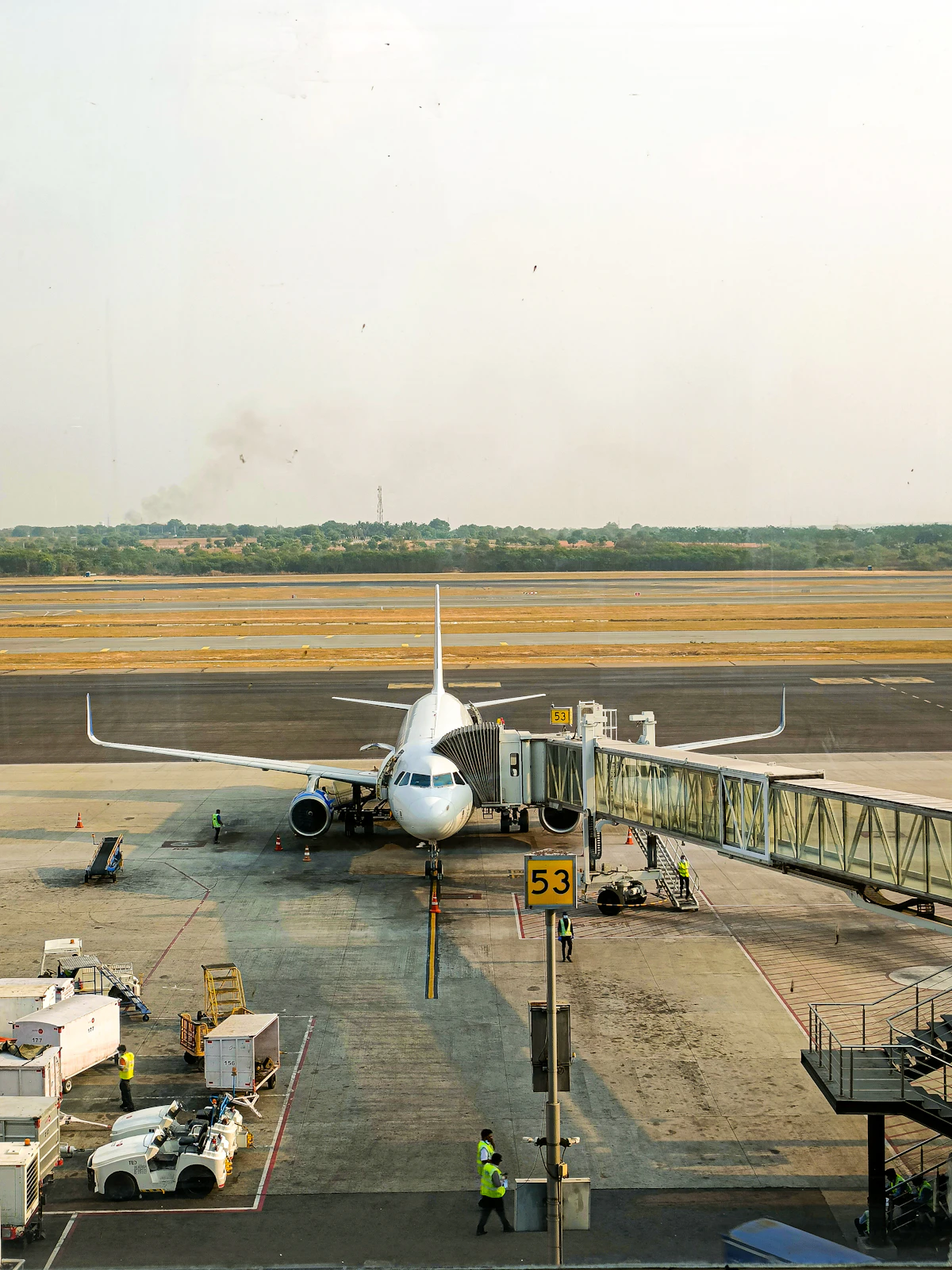 A jet bridge connected to an aircraft at an airport gate