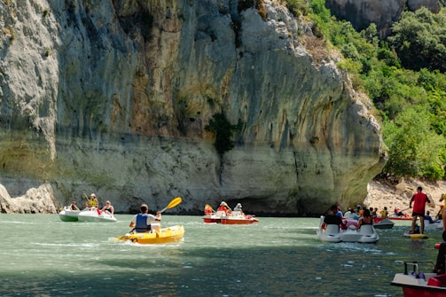people in boats in water