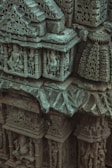 Close-up of intricate carvings on historical stone structures.