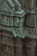 A close-up of intricately carved stone sculpture details.