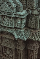 A close-up of detailed carvings on an Edwardian building.