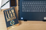 a book and a laptop on a table