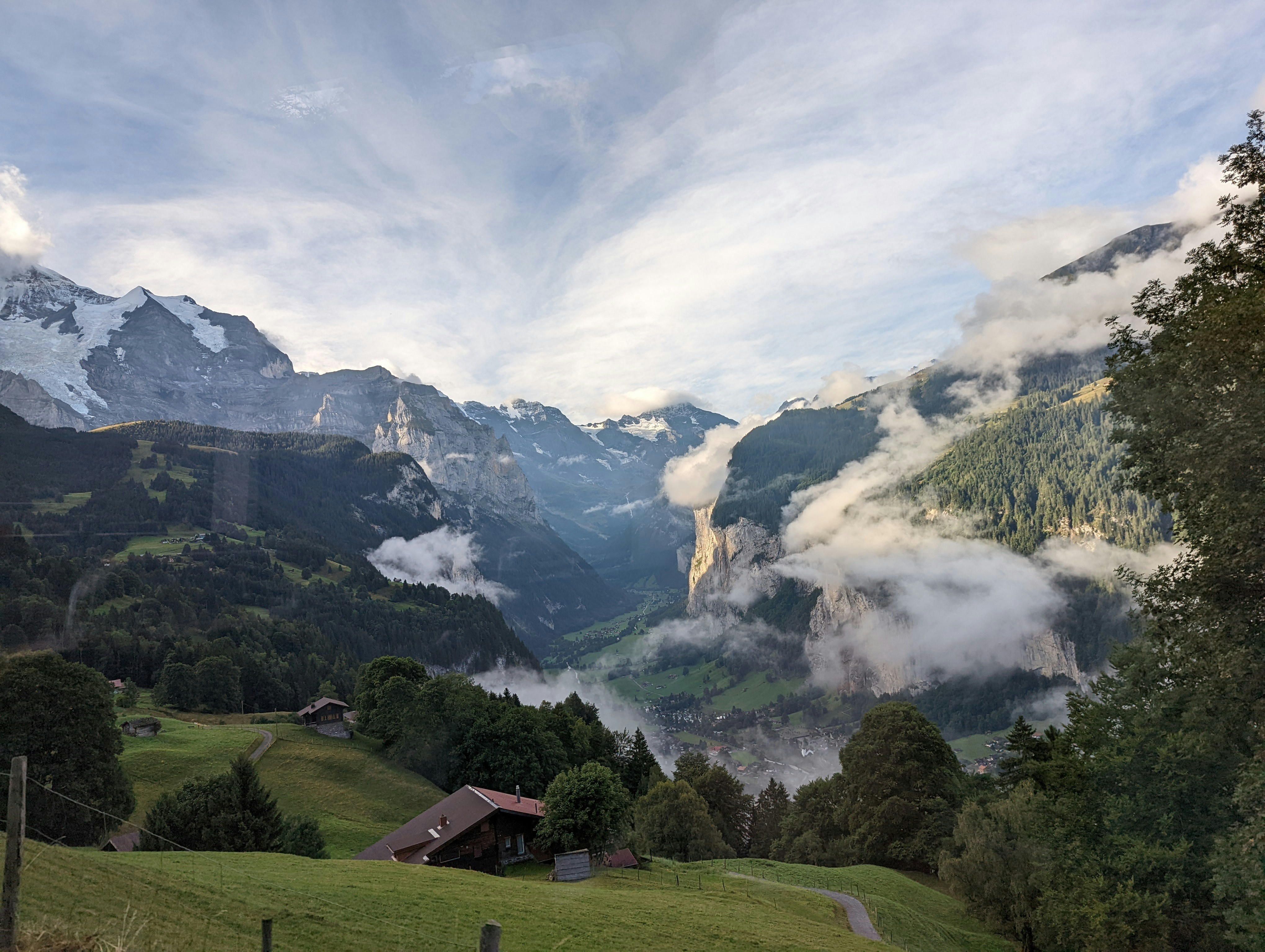 A house in Lauterbrunnen valley with mountains in the background