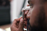 a man using a stethoscope to examine a person's ear