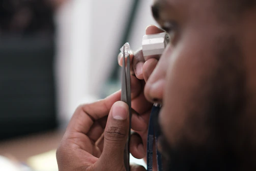 a man using a stethoscope to examine a person's ear
