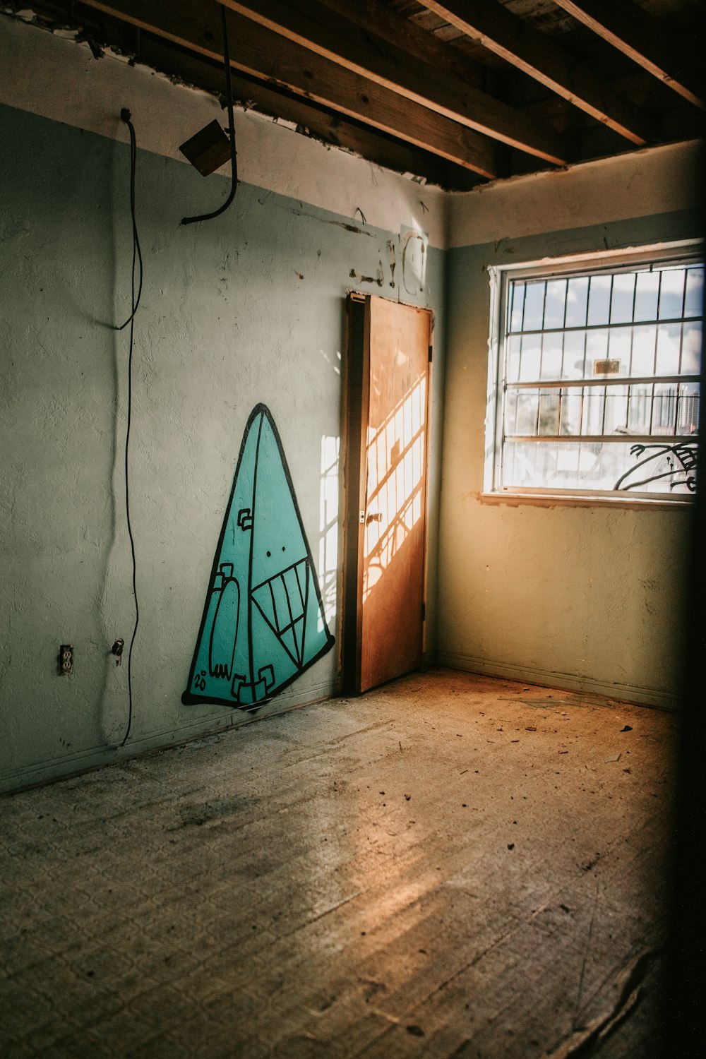 a room with a wall with graffiti