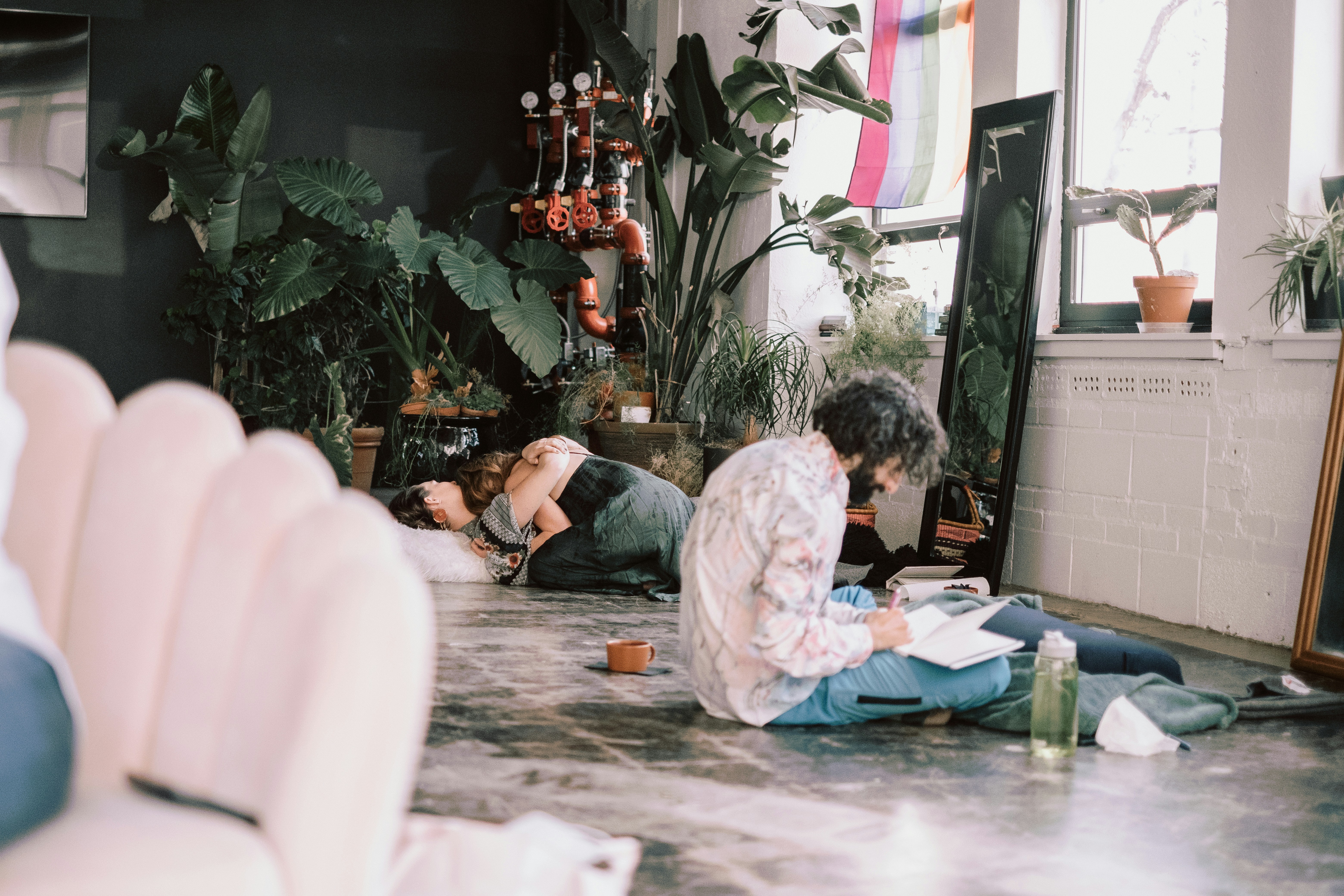 a man and woman sitting on the floor