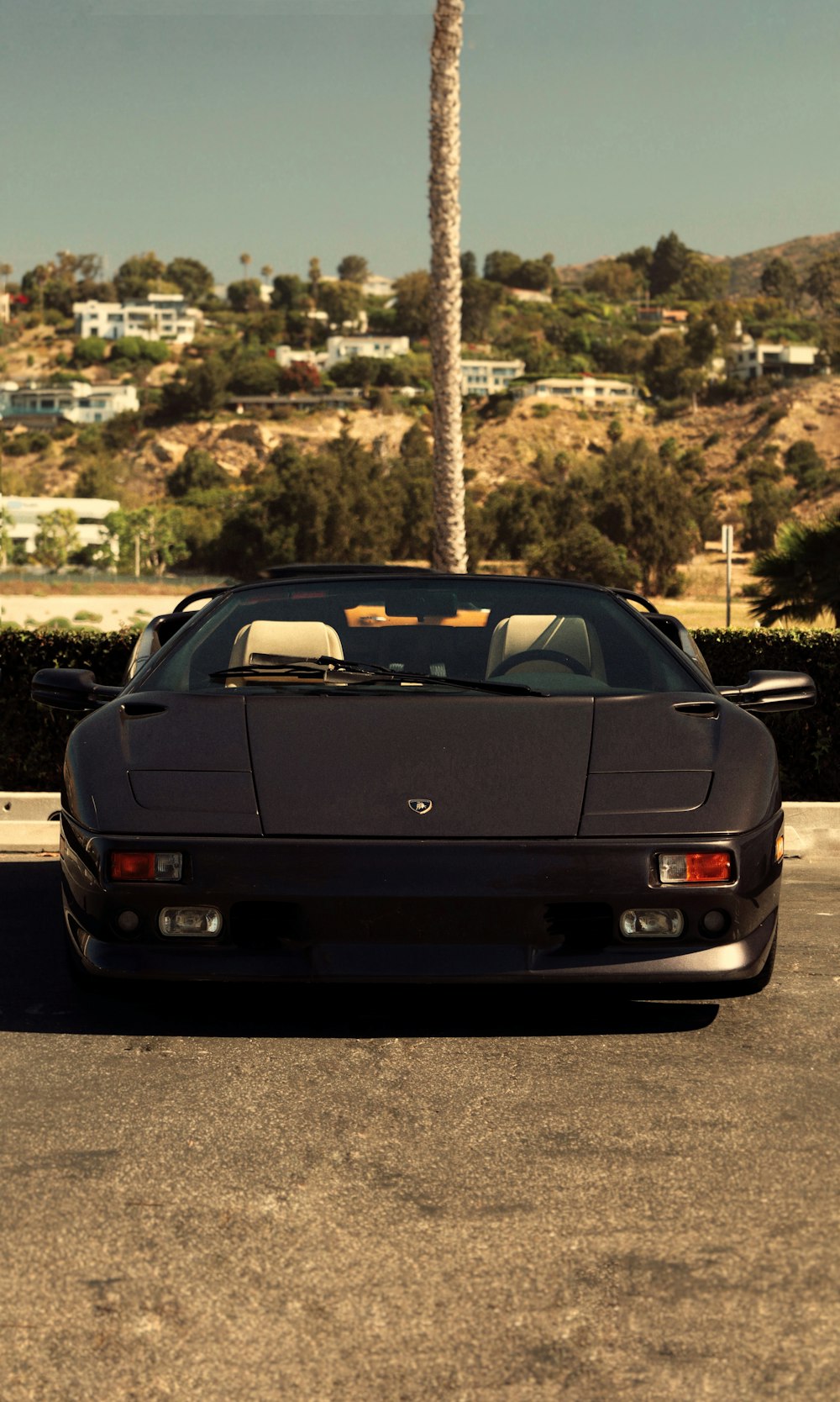 a black car parked on a road