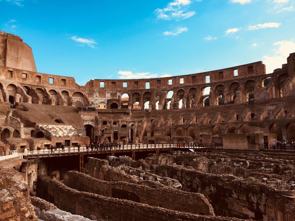 a large ancient building with Colosseum in the background