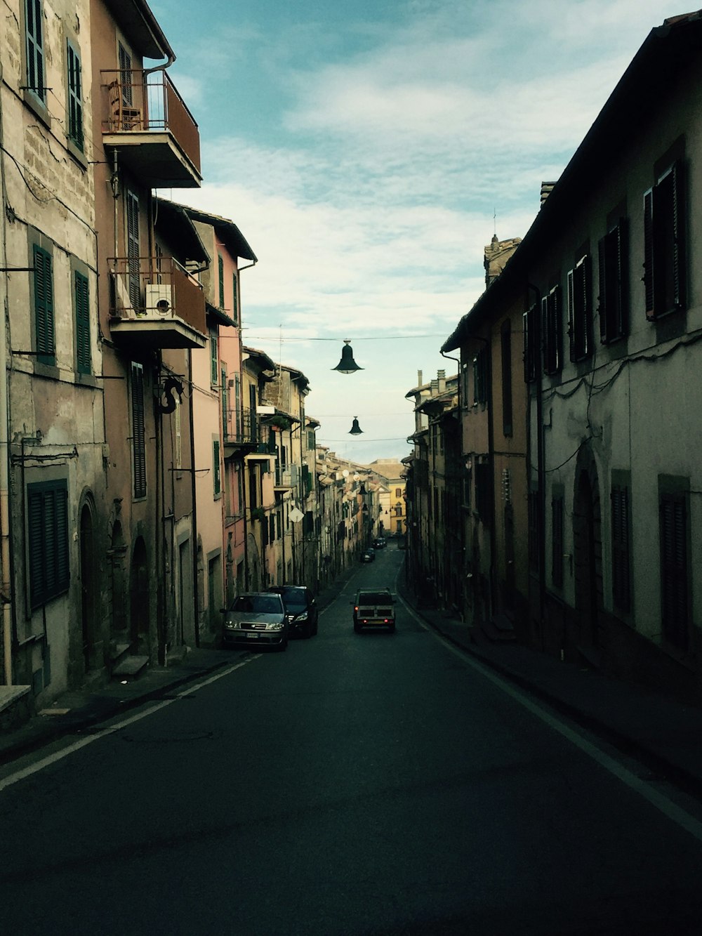 a street with cars and buildings