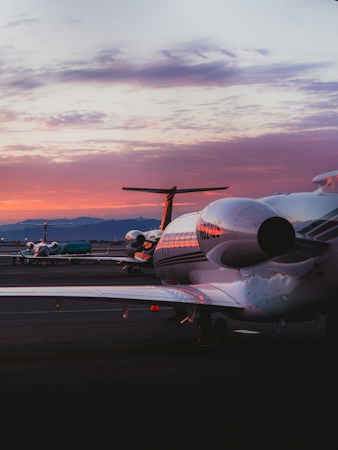 A passenger jet on an airport runway, a reminder that Waymo now offers driverless rides to Harry Reid International Airport in Las Vegas