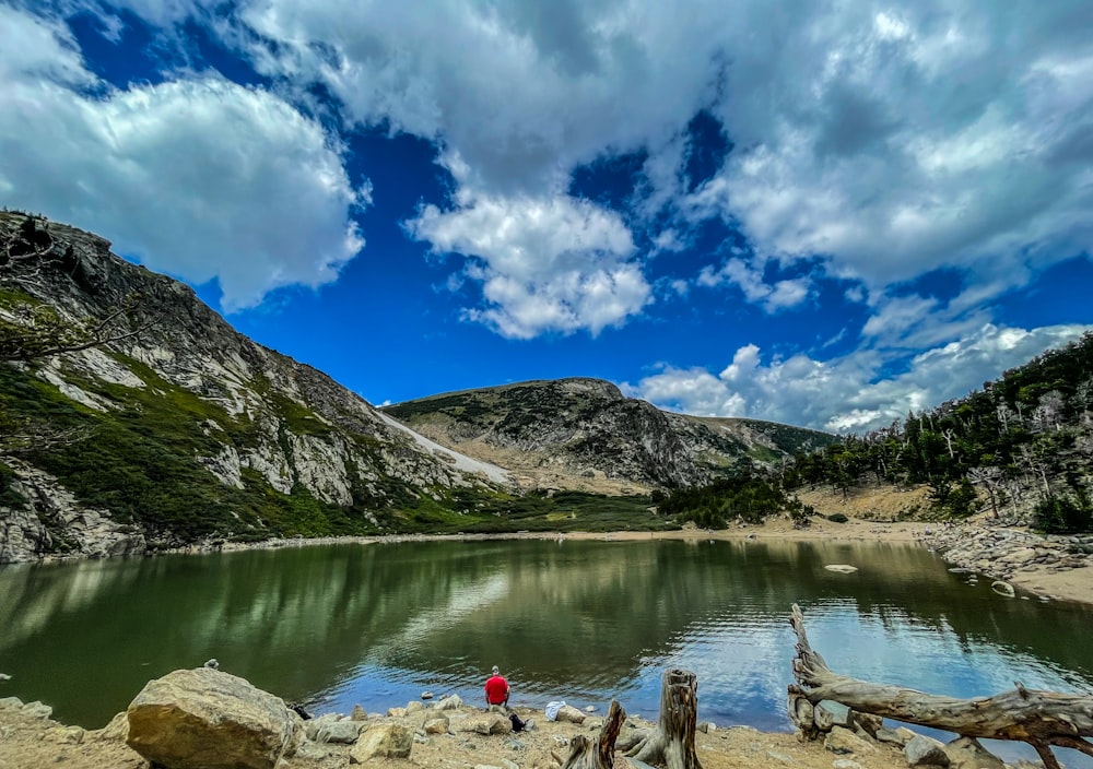 a lake with mountains in the background