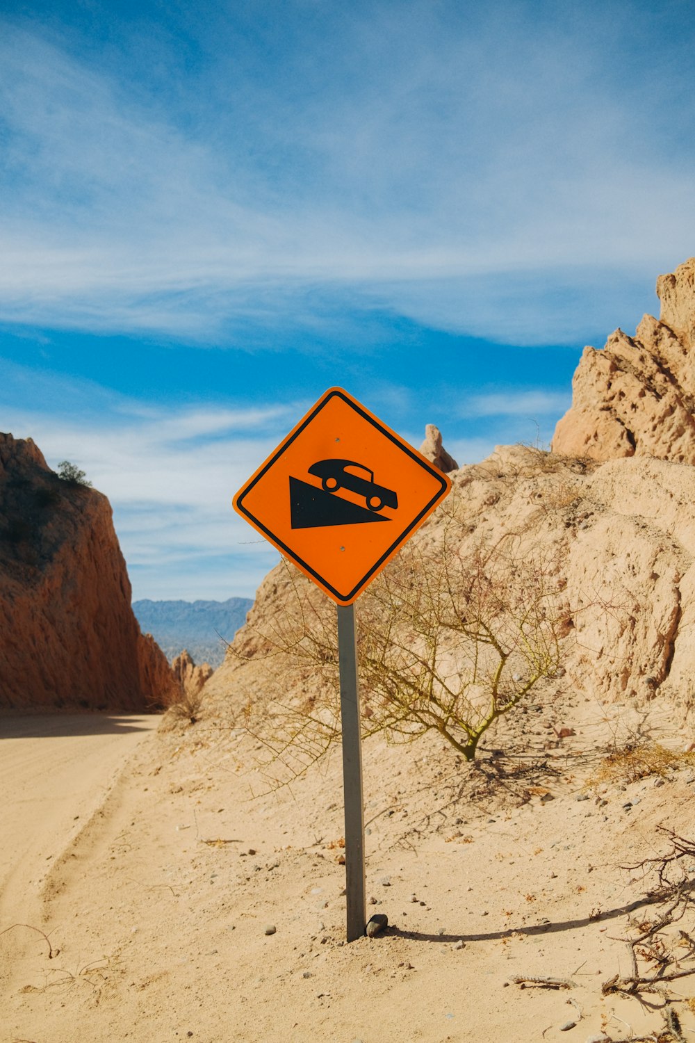 a sign on a desert road