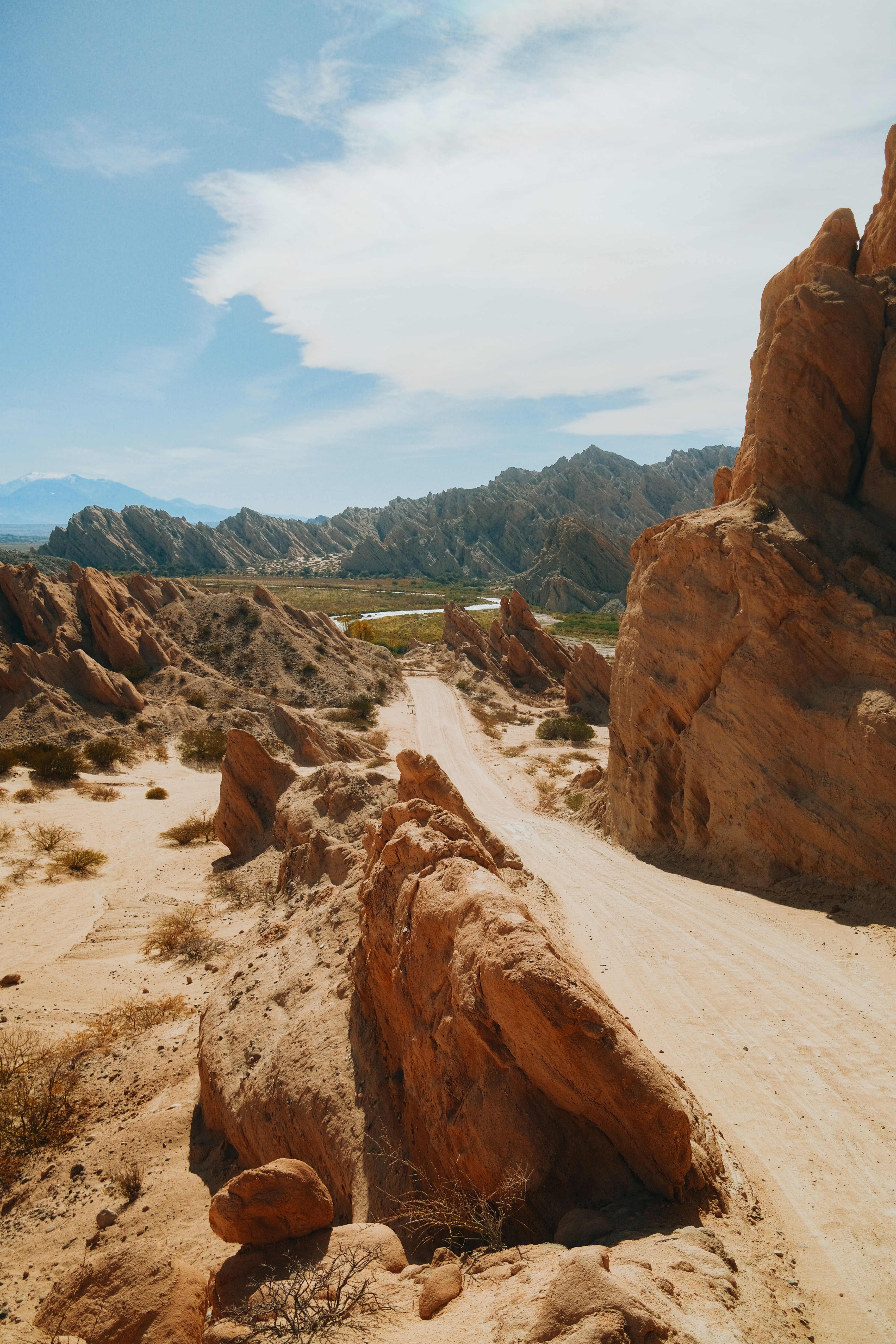 a rocky canyon with a river running through it