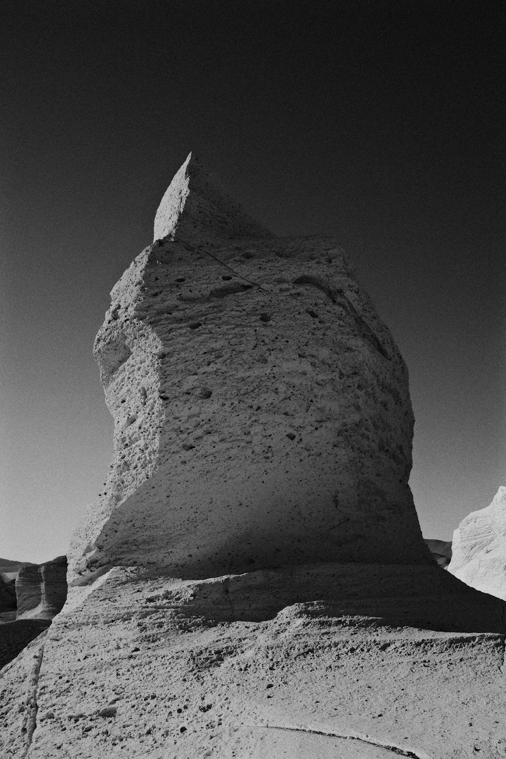 a large rock with a white top