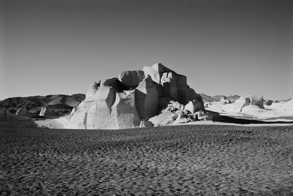 a group of large rocks in a desert