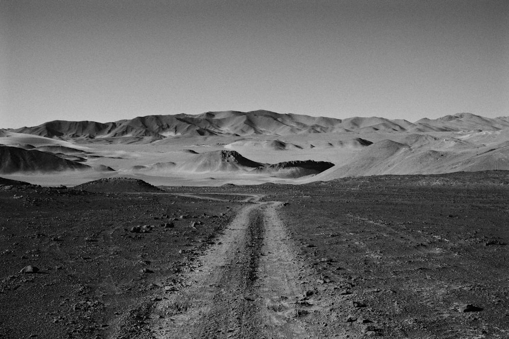 a dirt road in the desert