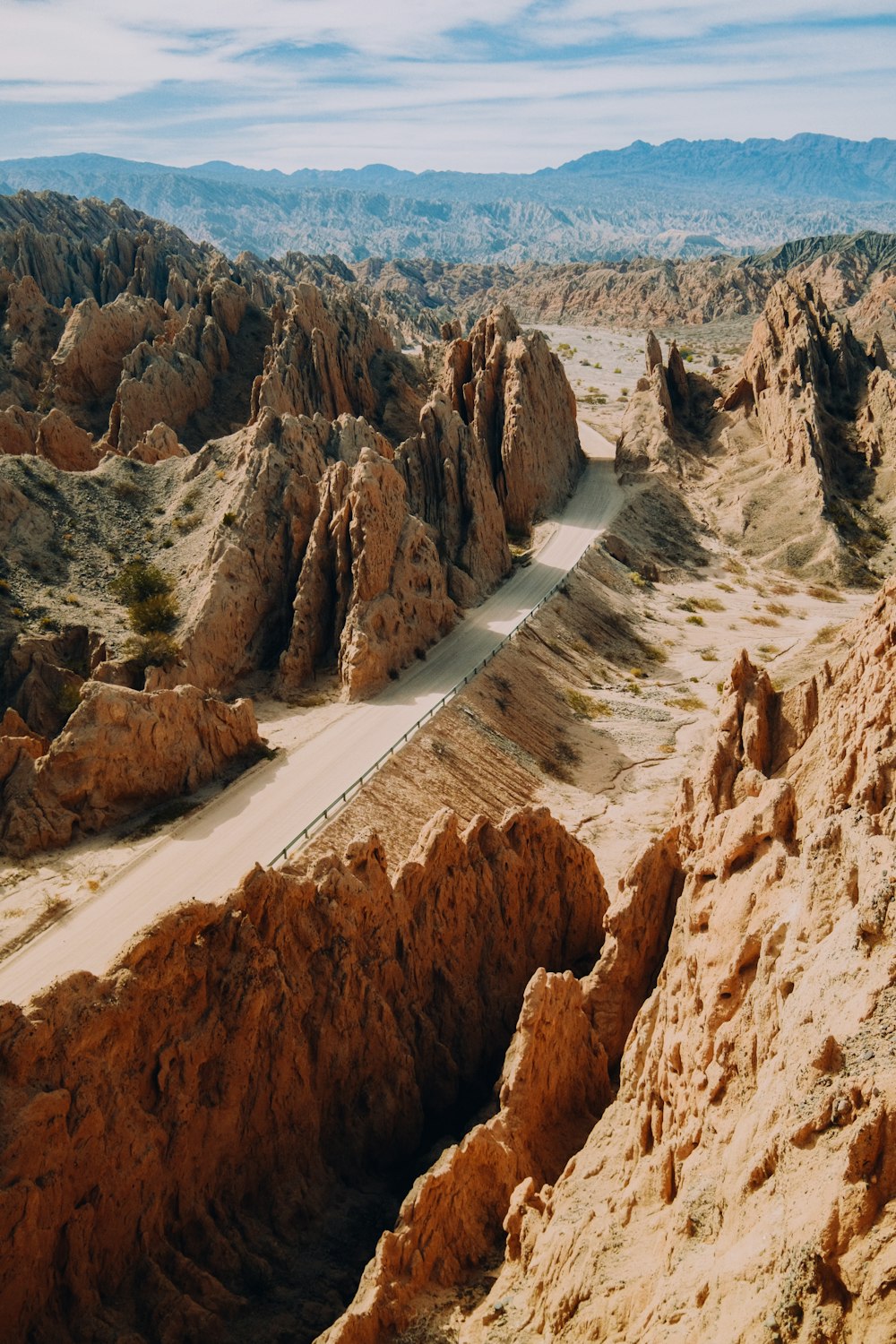 a rocky canyon with a river running through it