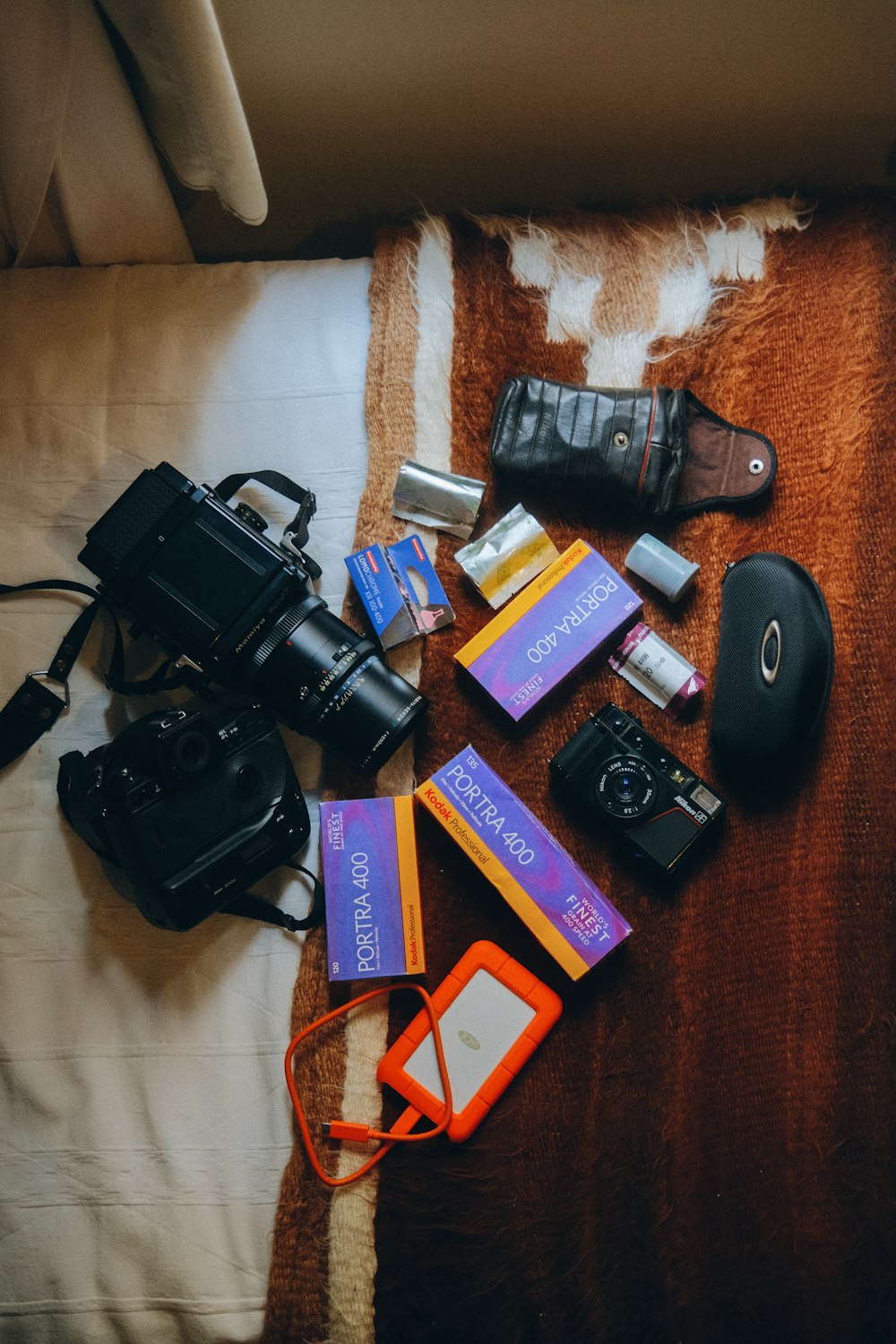 a group of electronics on a bed