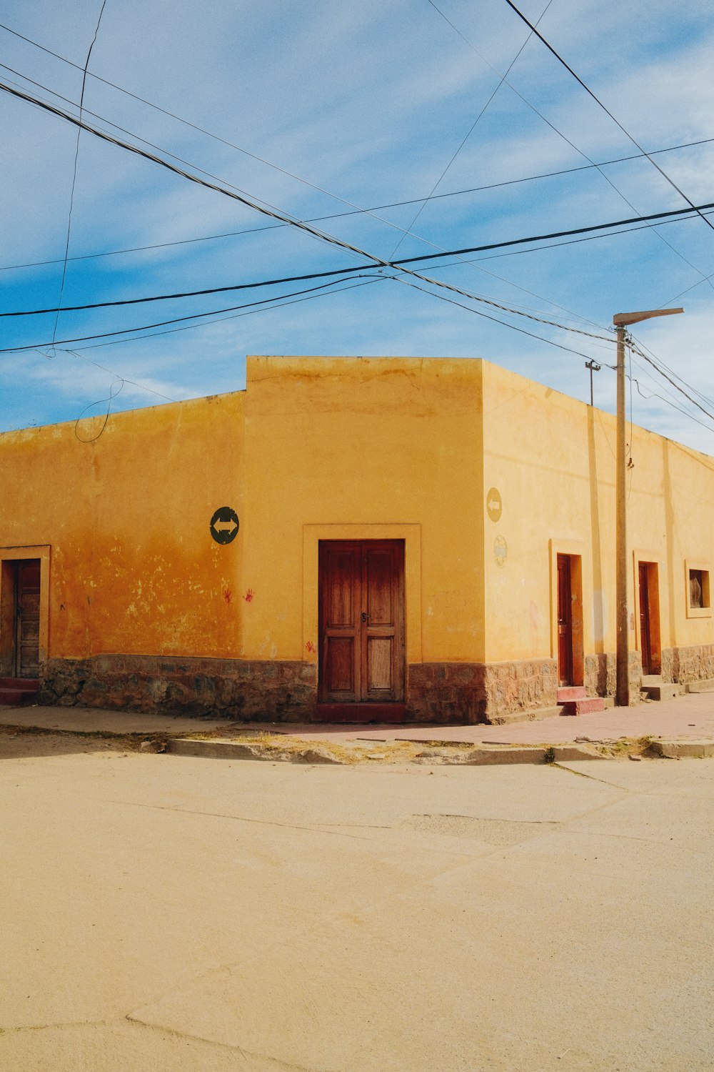 a building with a door and wires