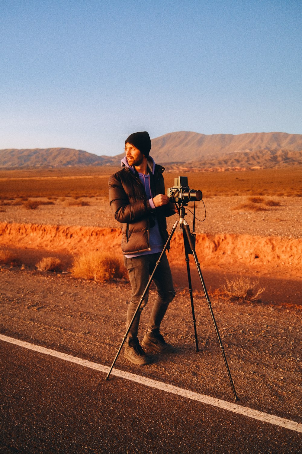 a man standing on a tripod