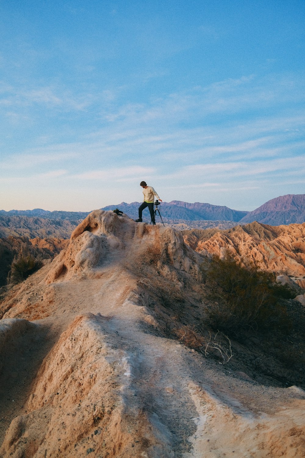 a person walking on a rock