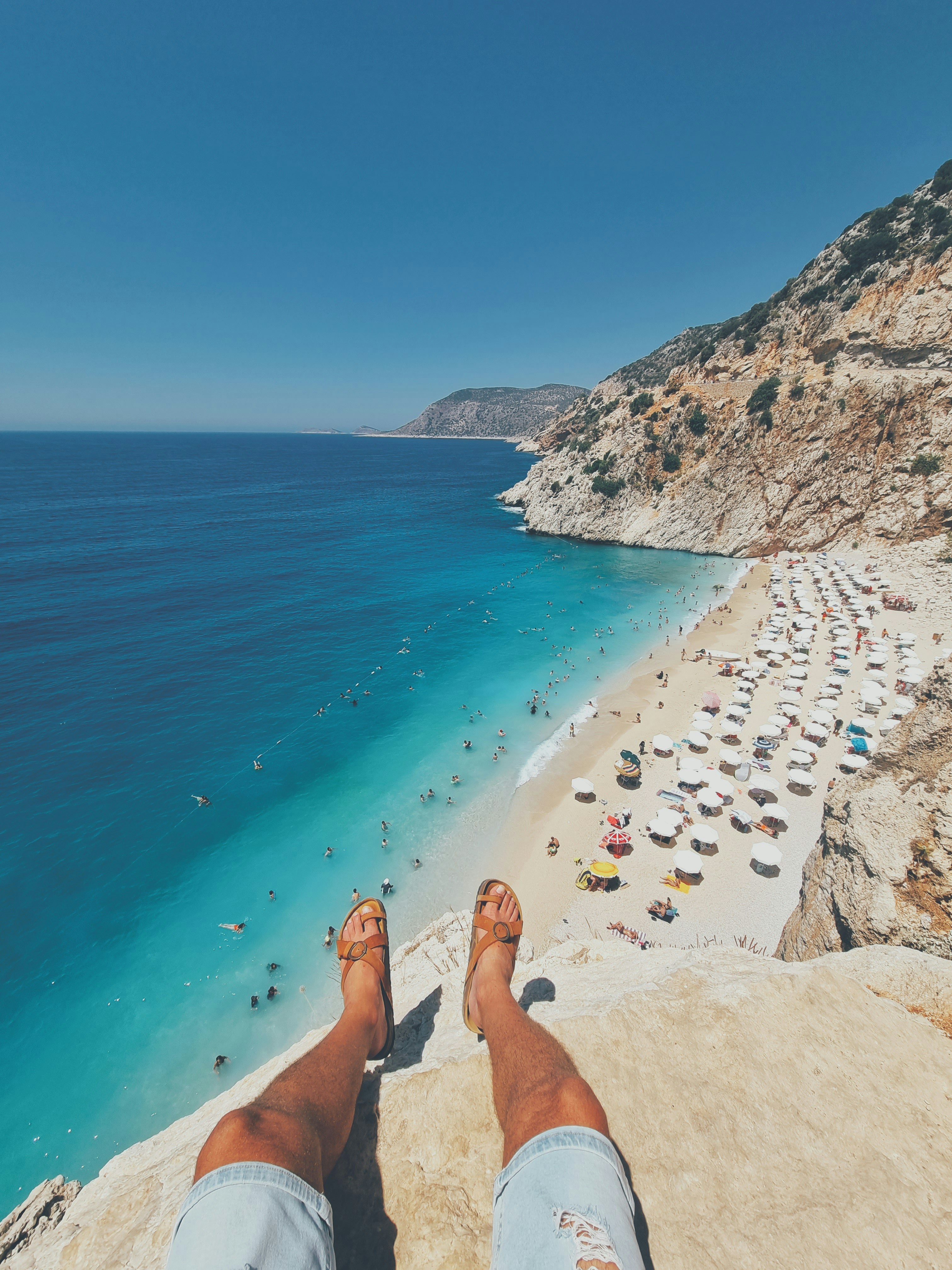 a person's feet on a beach