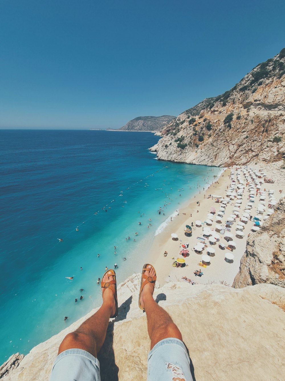 a person's feet on a beach