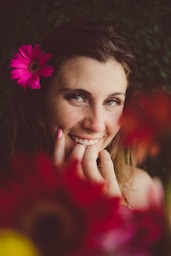 a person with a flower in the hair