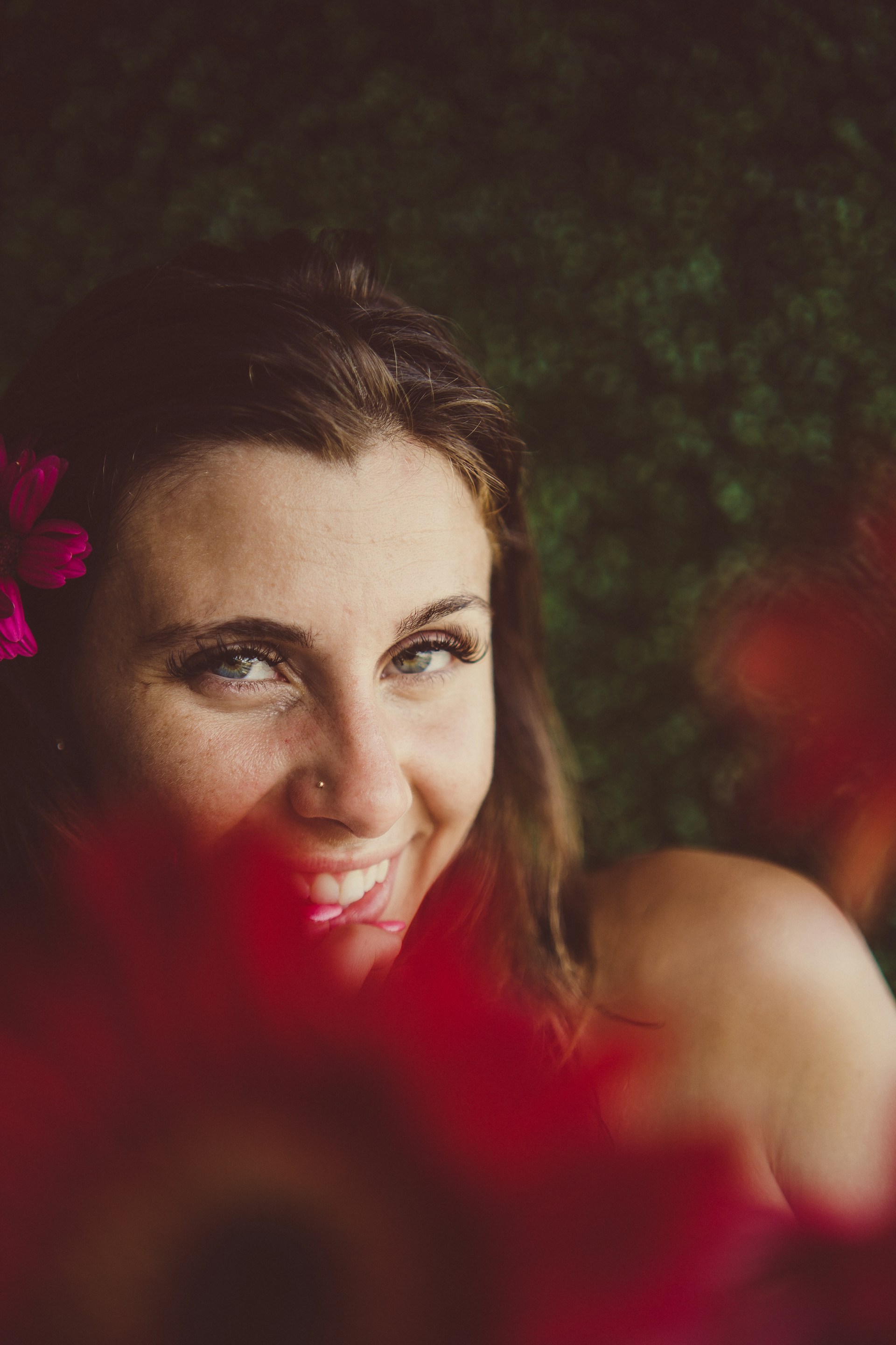 a person with a flower in the hair