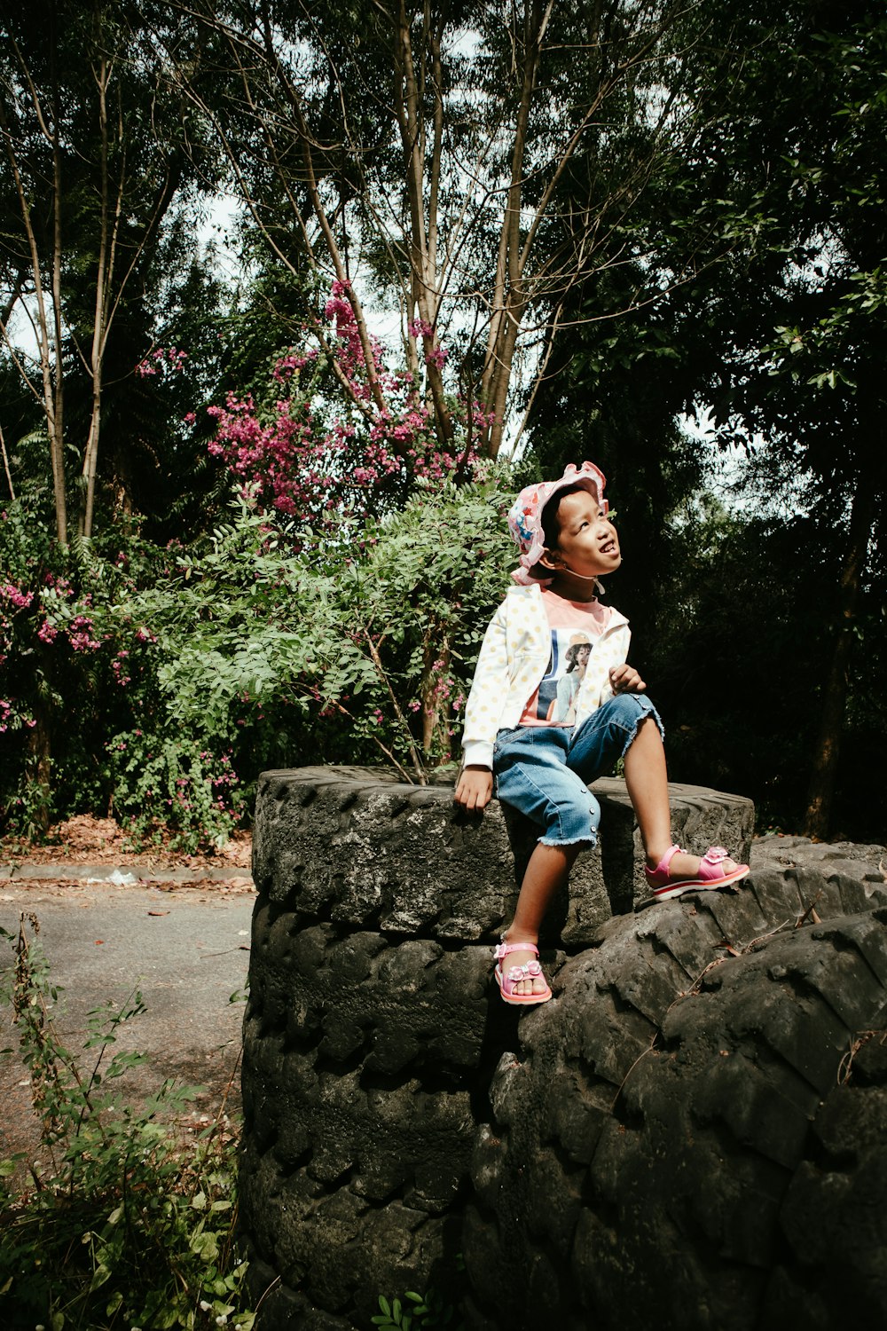 a person sitting on a rock