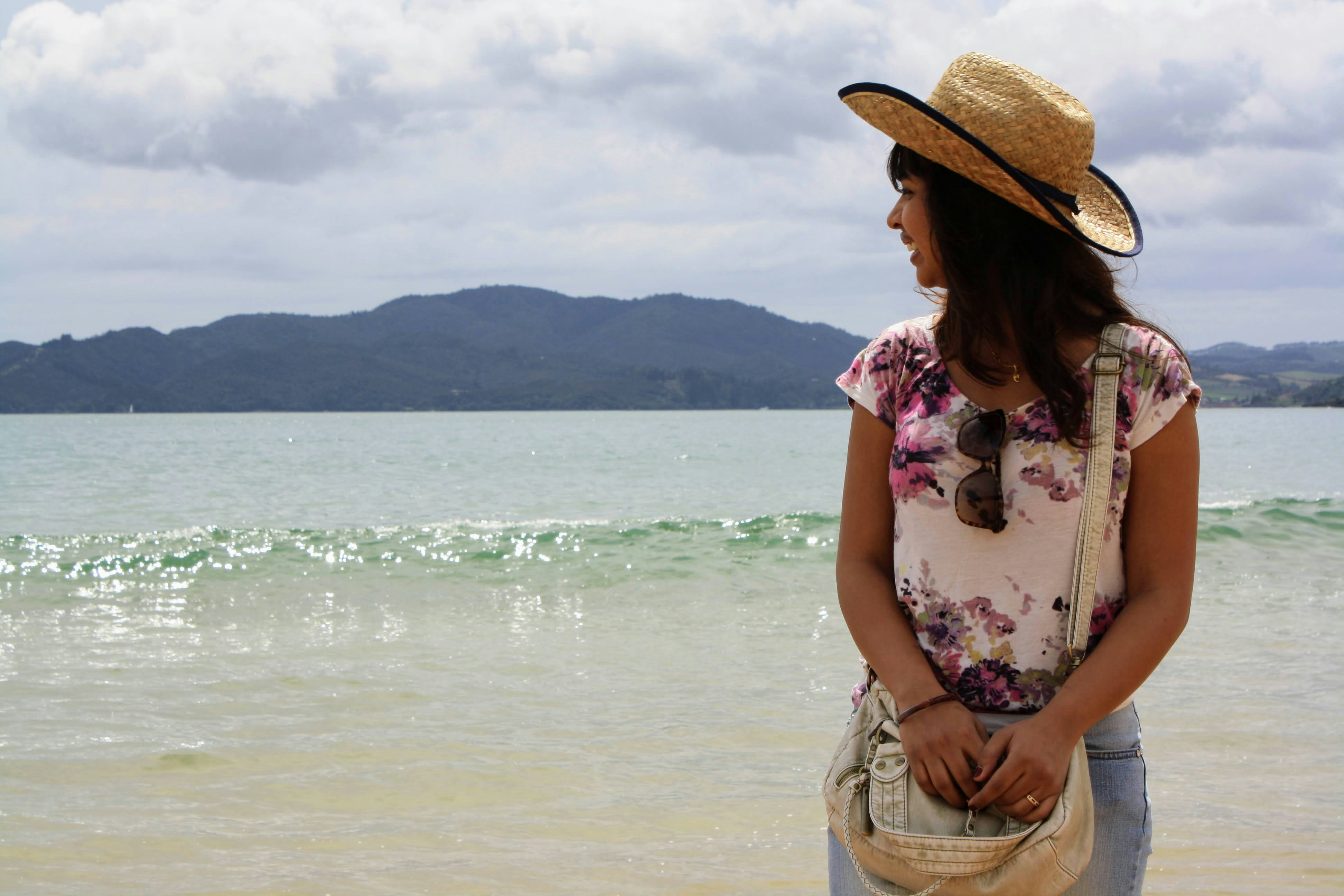 a woman standing on a beach