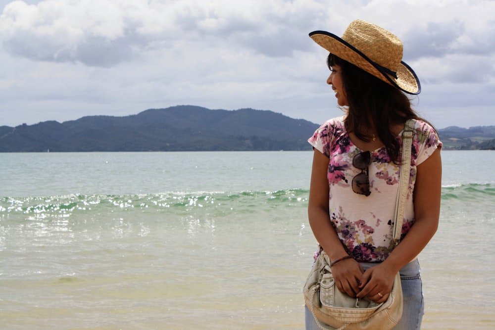 a woman standing on a beach