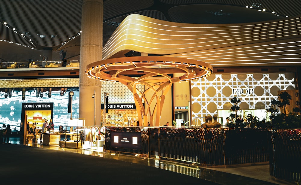 a large building with a large glass front and a large circular ceiling