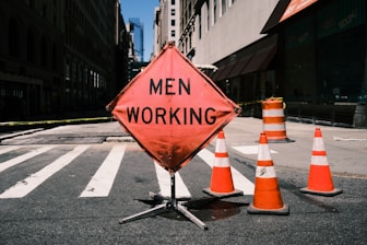 a road sign is posted on the side of a road