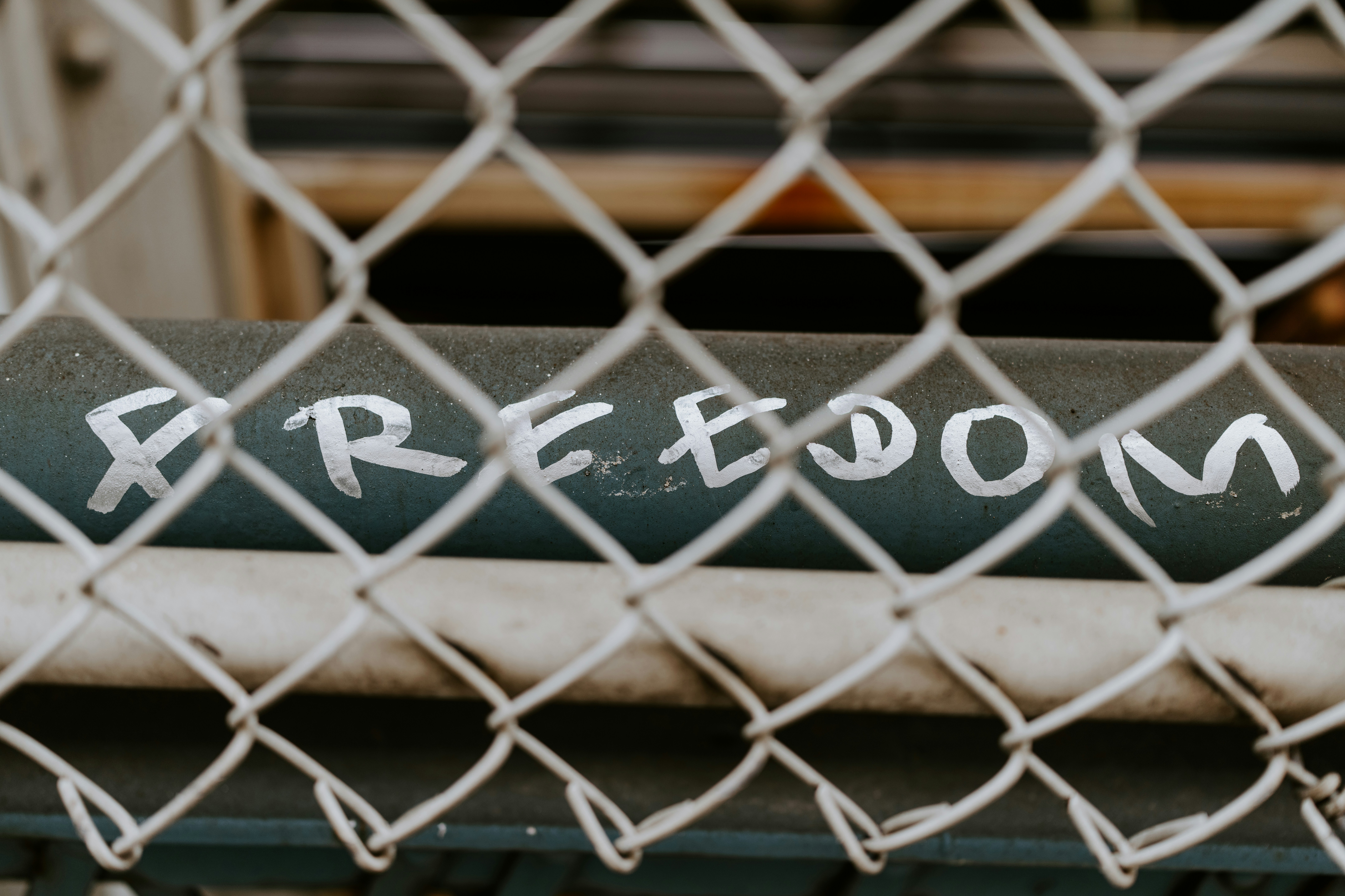 a sign on a metal fence