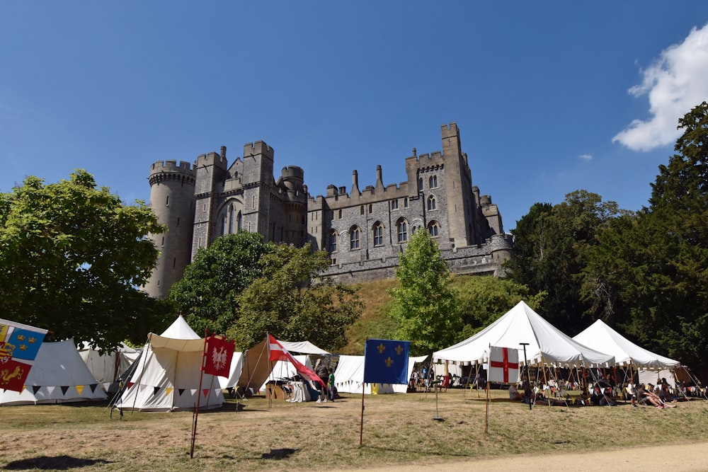 a castle with many tents in front of it