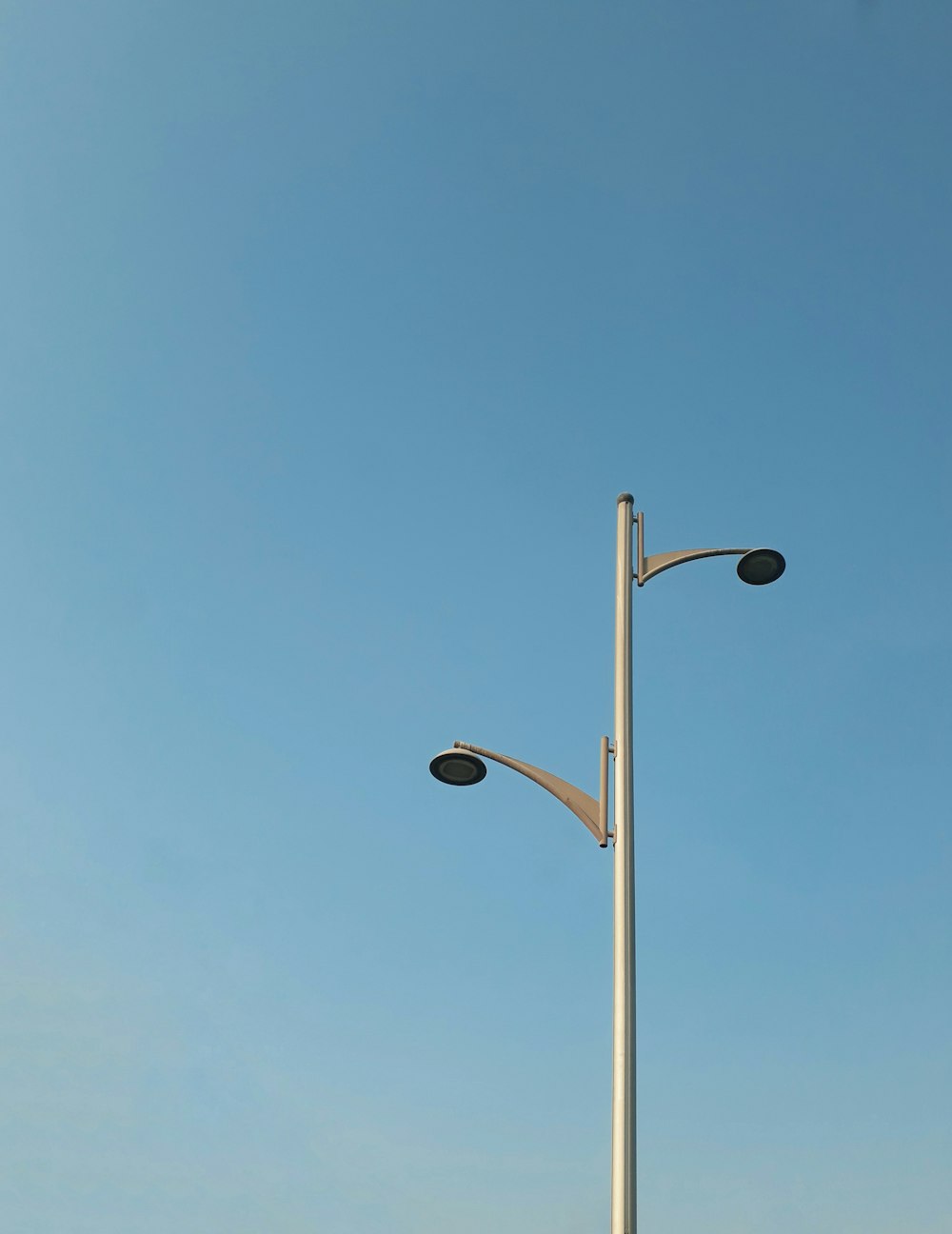 a light post with a blue sky