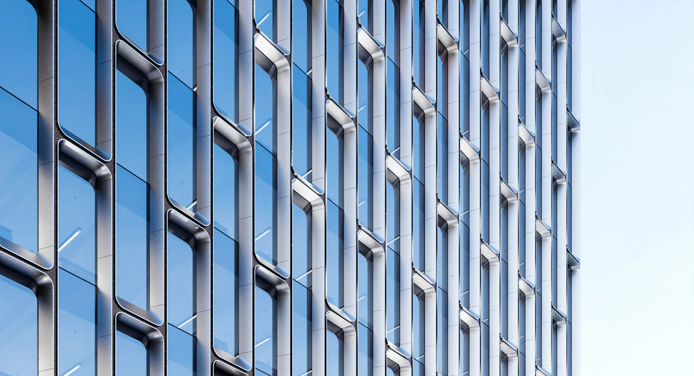 A glass office tower with a precise grid of windows.