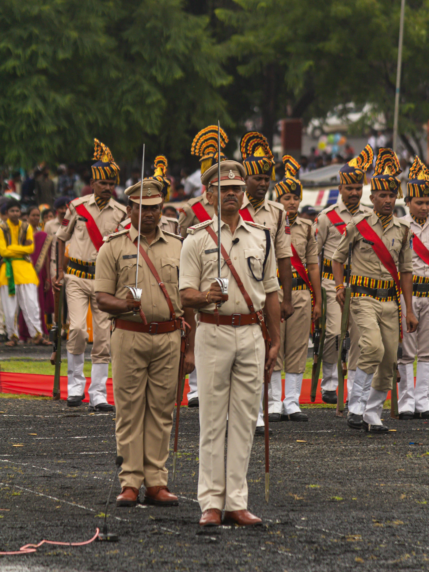 Cadets marching in formation at a military academy style campus