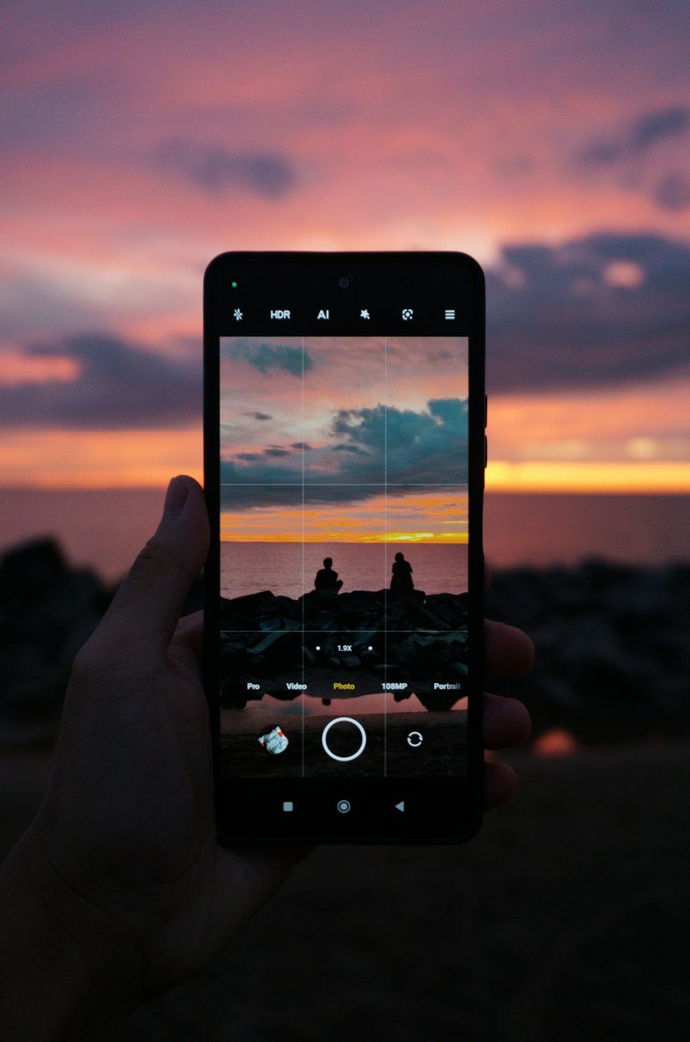 a hand holding a cell phone